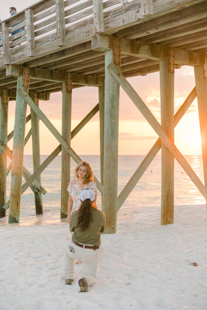 A breathtaking golden hour occurs while Lexy proposes to Maddie. The sun sets on their amazing day. 