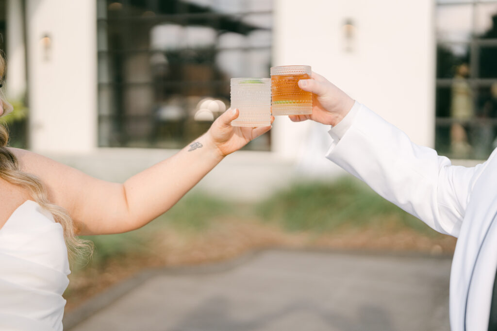 Newlywed couple cheer-sing to their I do with their signature alcohol drinks. 